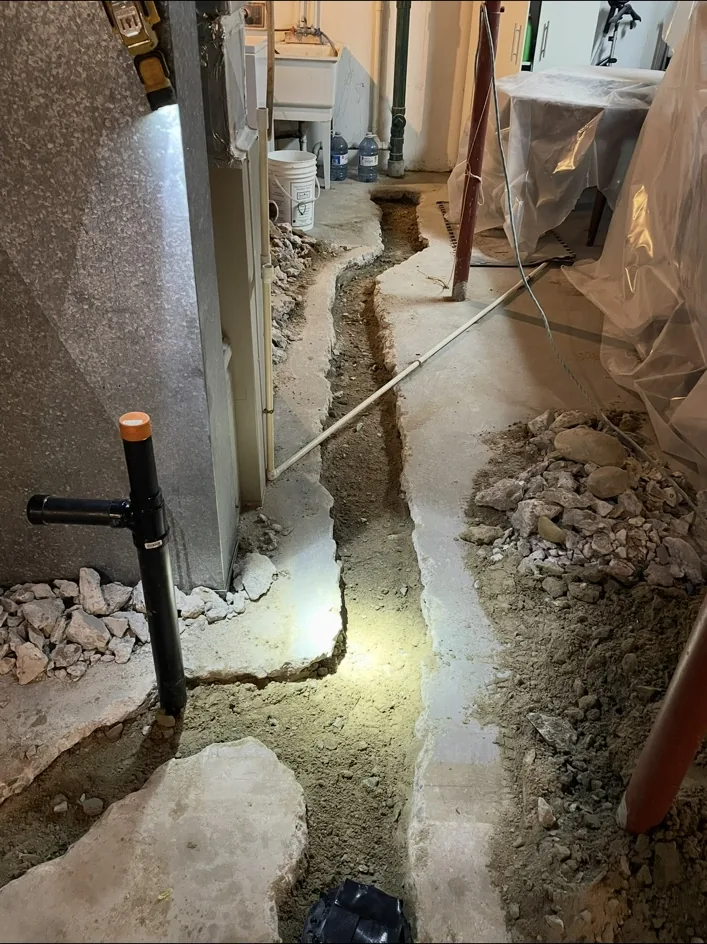 Basement concrete opened for underground plumbing
