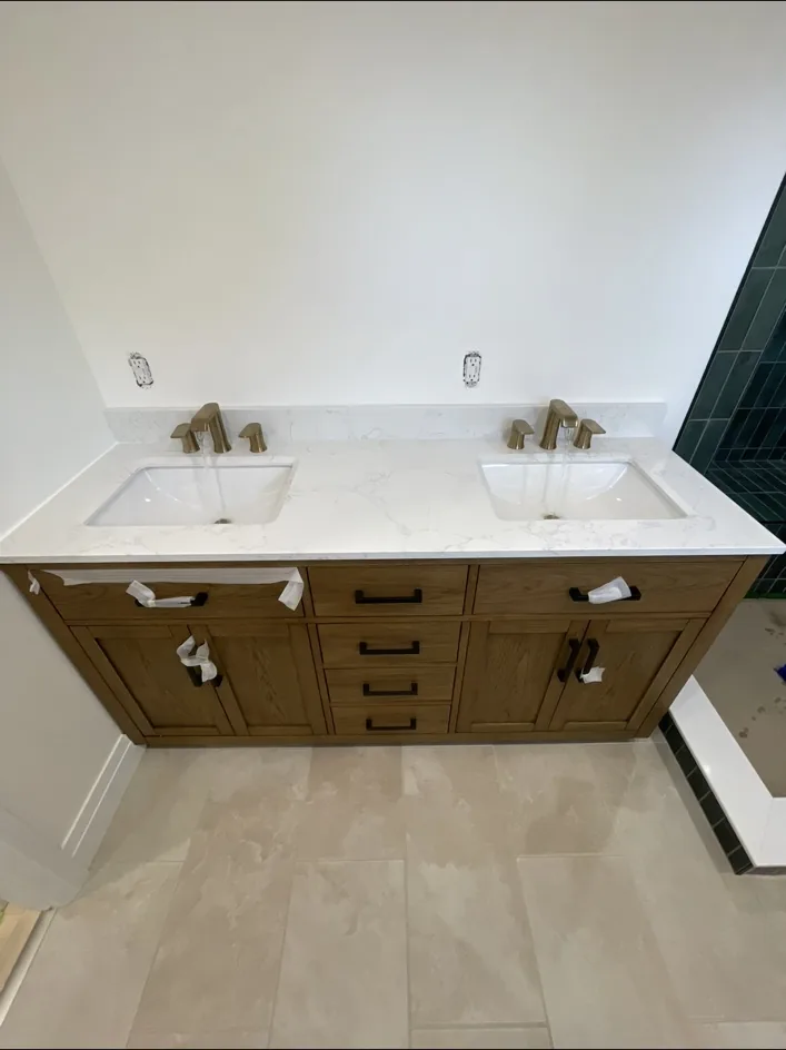 Double vanity with two finished faucet installations
