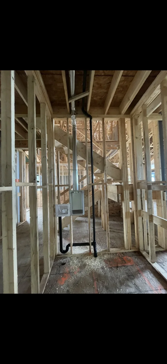New construction plumbing rough-in in a framed home