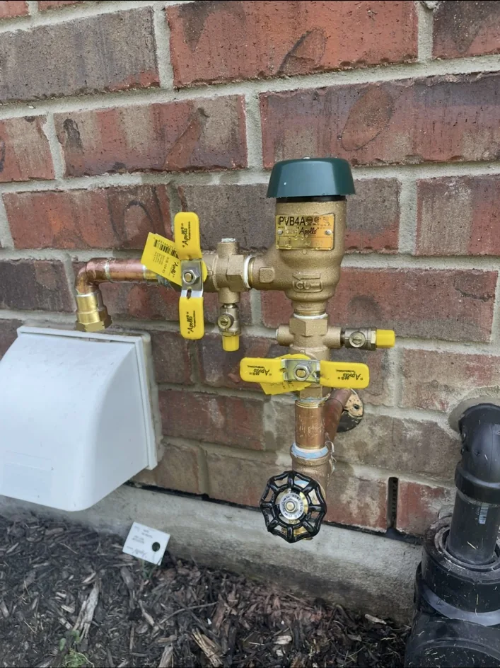 Pressure vacuum breaker installed on brick wall