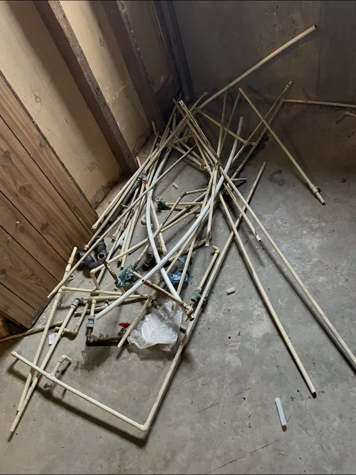 Pile of removed old plumbing pipe
