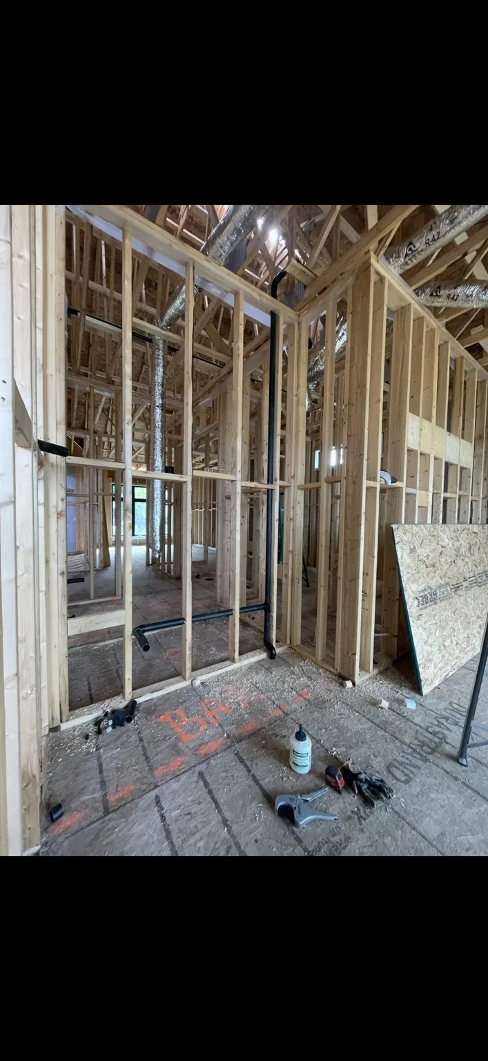 New home plumbing drainage and vent rough-in during framing