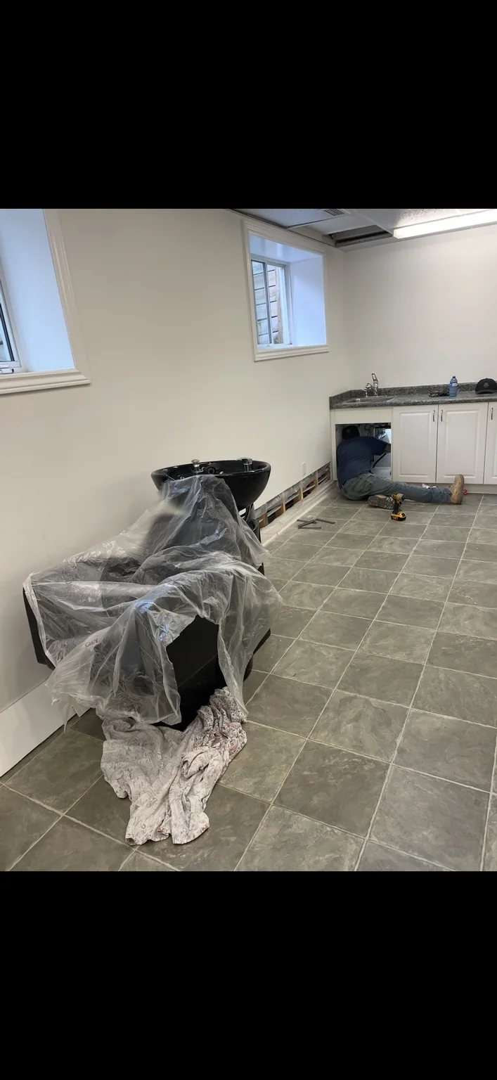 BG Plumbing crew completing a water-line tie-in in a salon build-out